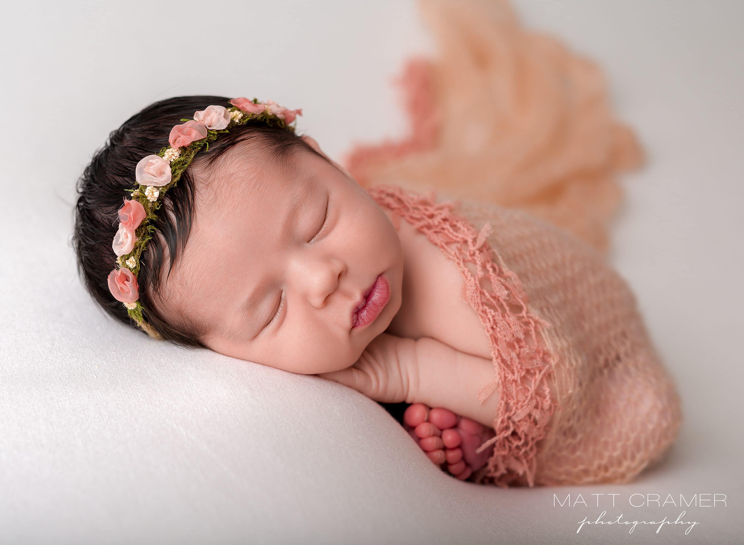 newborn baby girl posed for photoshoot