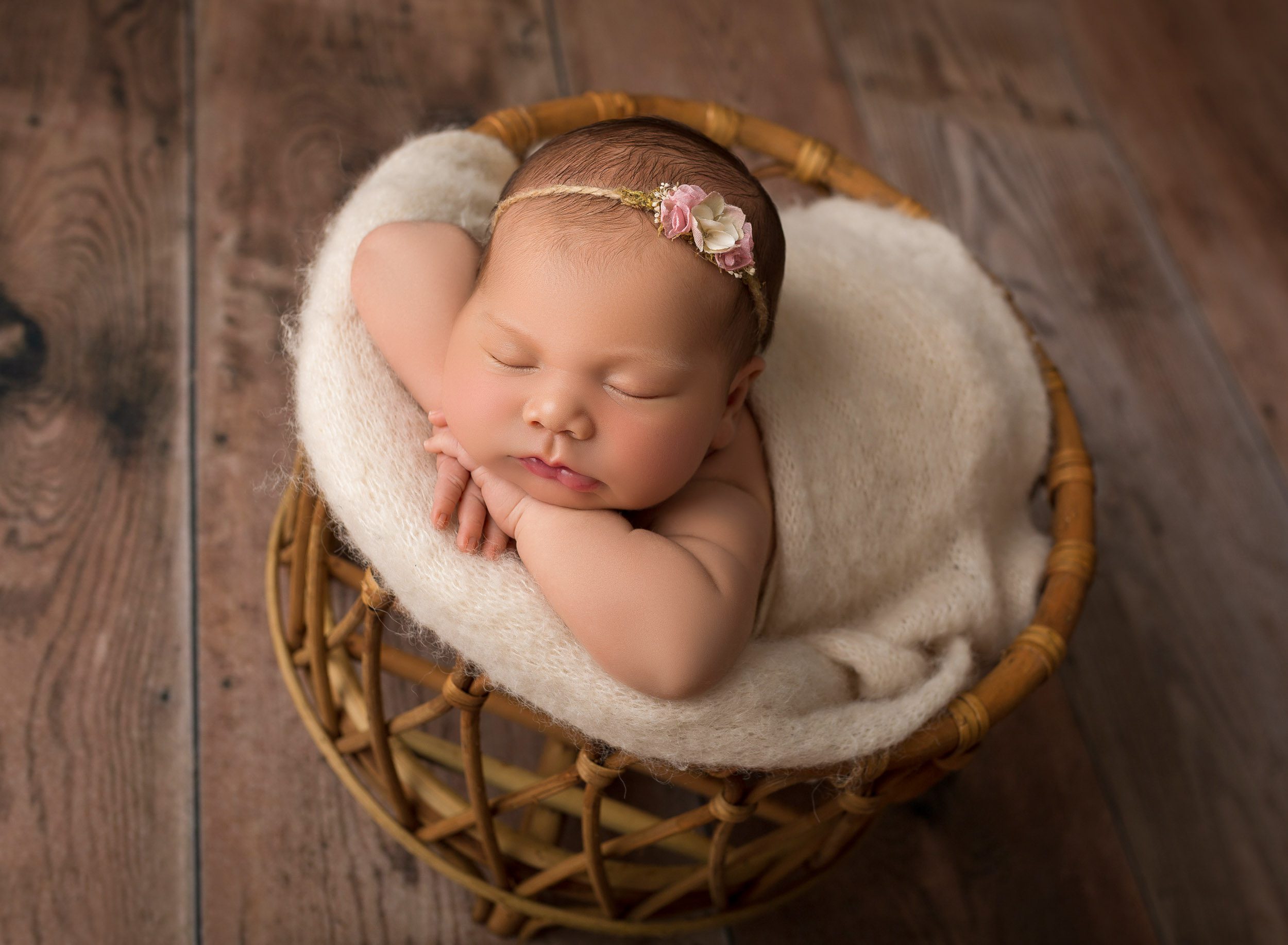 baby girl in wood prop