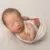 newborn photography baby boy in cream swaddle wrap