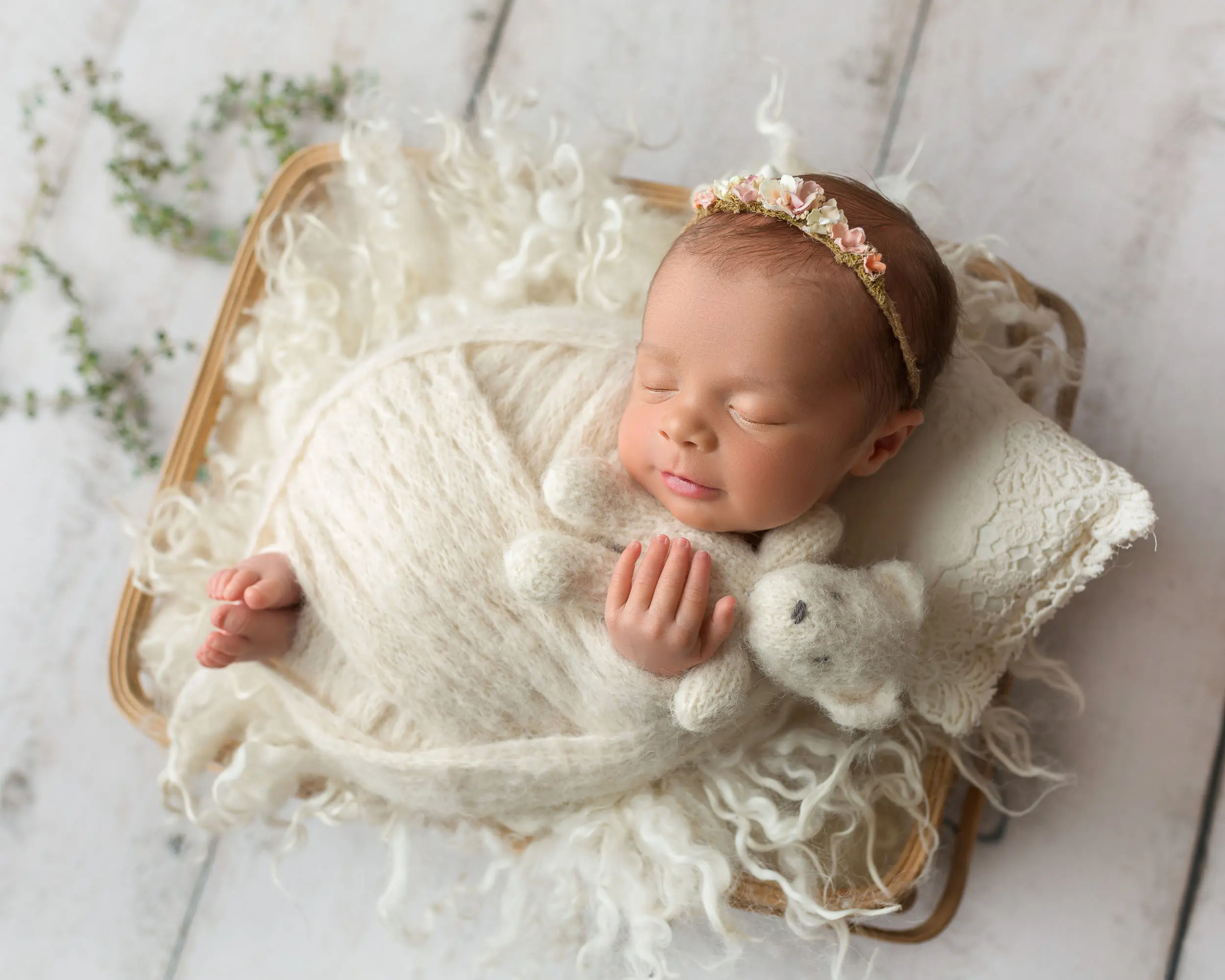 baby girl snuggling teddy bear