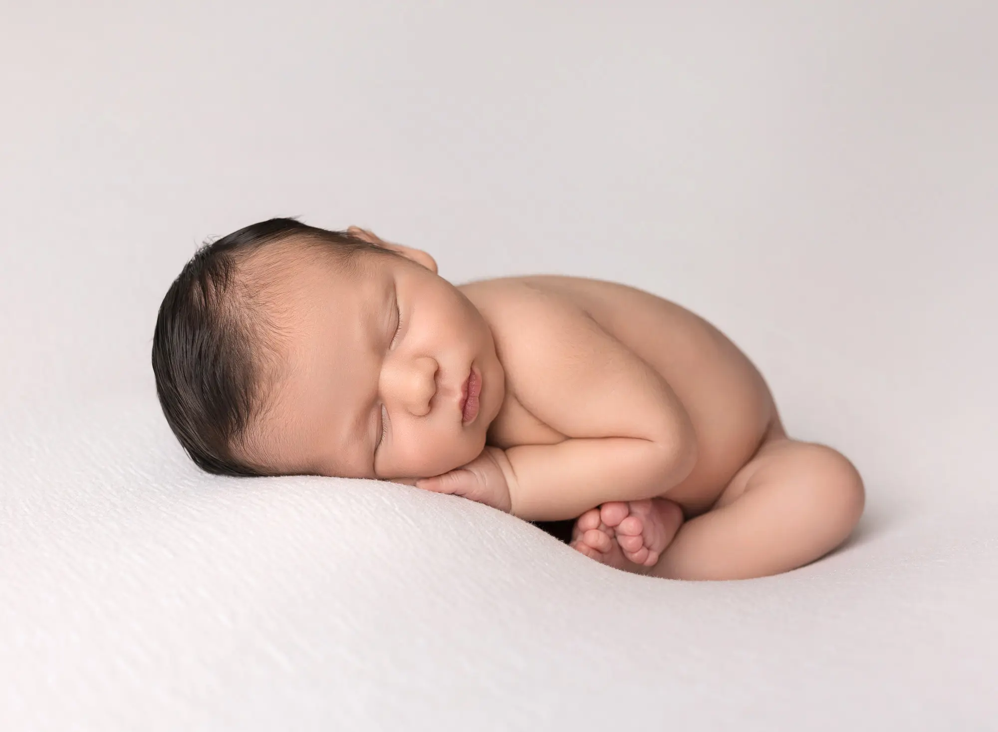 newborn baby boy in pose