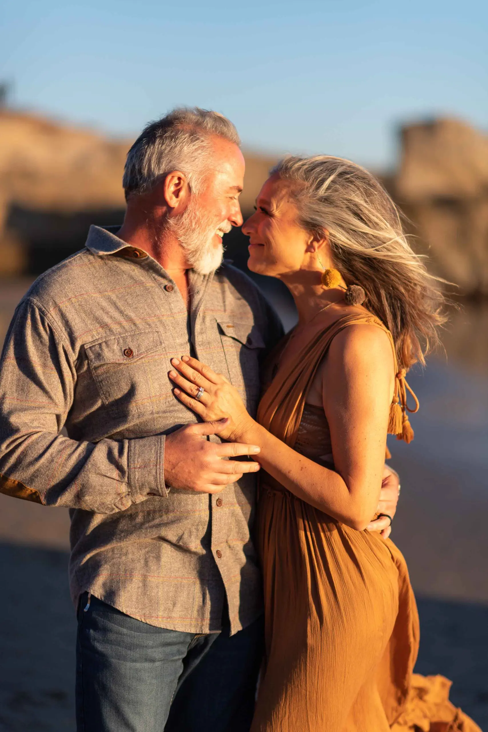 Couple embracing on beach in Leo Carillo